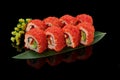 California rolls with eel on bamboo leaf on black background Royalty Free Stock Photo