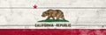 California State flag on a wooden surface. Banner of the grunge California State flag Royalty Free Stock Photo