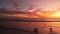 California summertime beach aesthetic, golden sunset. Vivid dramatic clouds over pacific ocean waves. Santa Monica popular resort Royalty Free Stock Photo