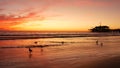 California summertime beach aesthetic, golden sunset. Vivid dramatic clouds over pacific ocean waves. Santa Monica popular resort Royalty Free Stock Photo