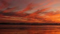 California summertime beach aesthetic, golden sunset. Vivid dramatic clouds over pacific ocean waves. Santa Monica popular resort Royalty Free Stock Photo