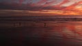 California summertime beach aesthetic, golden sunset. Vivid dramatic clouds over pacific ocean waves. Santa Monica popular resort Royalty Free Stock Photo