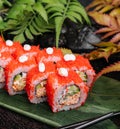 California Sushi roll cutting on a bamboo leaf