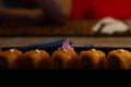 California sushi roll plate with orange tobiko and ginger Royalty Free Stock Photo