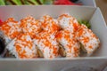 California sushi rolls set in carton box close up. Food for take away or sushi delivery concept