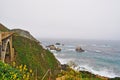 Big Sur, Bixby Creek Bridge, viewpoint, green, landscape, nature, California, Usa, cliff, beach, coastline, mist, fog, road Royalty Free Stock Photo