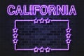 California US State glowing violet neon letters and starred frame on a black brick wall