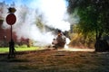 California. USA. October 2012. An ancient train moves along the rails releasing smoke in the sun