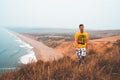 Young man exploring California by the ocean at Point Reyes cliffs. Royalty Free Stock Photo