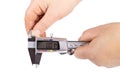 caliper. a device for measuring precision. the size of a part, as well as the diameter. close-up. it is in a person