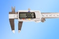 caliper. a device for measuring precision. the size of a part, as well as the diameter. close-up.