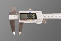 caliper. a device for measuring precision. the size of a part, as well as the diameter. close-up.