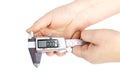 caliper. a device for measuring precision. the size of a part, as well as the diameter. close-up. it is in a person