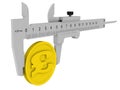 The caliper measures a coin with the British Pound Sterling