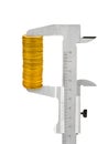 Calipers and stack of coins Royalty Free Stock Photo