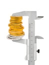 Calipers and stack of coins Royalty Free Stock Photo