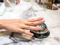 Call bell in restaurant vintage with hand service granite background luxury. Royalty Free Stock Photo