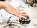 Call bell in restaurant vintage with hand service granite background luxury. Royalty Free Stock Photo