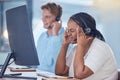 Call center agent with headache pain at work, telemarketing consultant with stress working in sales and tired business Royalty Free Stock Photo