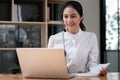 Call center agent with headset working on support hotline in office. Video conference