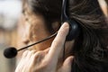 Call center agent talking in headset mic, using remote access tools, closeup Royalty Free Stock Photo