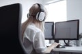 Call center agent using computer while communicating with clients in the office. Generative AI Royalty Free Stock Photo