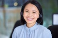 Call center, asian, woman and sales consultant with a smile for sales, customer support and telemarketing at office for Royalty Free Stock Photo