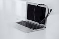 Call center and communication support, customer service help desk. VOIP headset on laptop computer Royalty Free Stock Photo