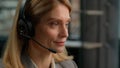 Call center customer service female worker middle aged woman in headset talking to client distant consultation Caucasian