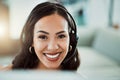 Call center, customer service and help desk agent looking friendly, happy and smiling while wearing a headset and Royalty Free Stock Photo