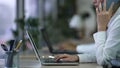 Call center employee having phone conversation with client, working on laptop Royalty Free Stock Photo