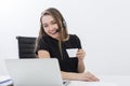 Call center employee smiling with coffee Royalty Free Stock Photo