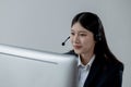 Call center employee talking with customer through headset, The operator is providing customer service by phone, Customer service Royalty Free Stock Photo