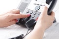 Call center or office phone concept, female finger press number on phonepad Royalty Free Stock Photo