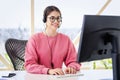 Call center operator businesswoman wearing headset and using computer while working from home Royalty Free Stock Photo