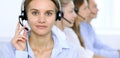 Call center operator in headset while consulting client. Telemarketing or phone sales Royalty Free Stock Photo