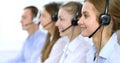 Call center operator in headset while consulting client. Telemarketing or phone sales Royalty Free Stock Photo