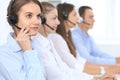 Call center operator in headset while consulting client. Telemarketing or phone sales. Customer service and business Royalty Free Stock Photo