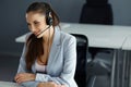 Call Center Operator Sitting Infront of Her Computer