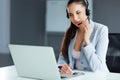 Call Center Operator Sitting Infront of Her Computer