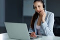 Call Center Operator Sitting Infront of Her Computer