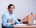 Call center operator working at his desk Royalty Free Stock Photo