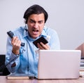 Call center operator working at his desk Royalty Free Stock Photo