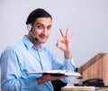 Call center operator working at his desk Royalty Free Stock Photo