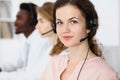 Call center operator.Young beautiful brunette woman in headset. Business concept Royalty Free Stock Photo