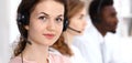 Call center operator.Young beautiful brunette woman in headset. Business concept Royalty Free Stock Photo