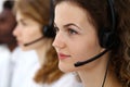 Call center operator.Young beautiful brunette woman in headset. Business concept Royalty Free Stock Photo