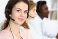 Call center operator.Young beautiful brunette woman in headset. Business concept Royalty Free Stock Photo