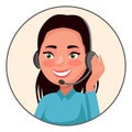 Call center operator.A young brunette girl communicates with a client on headphones with a microphone smiling.