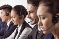 Call center operators in headsets working together Royalty Free Stock Photo